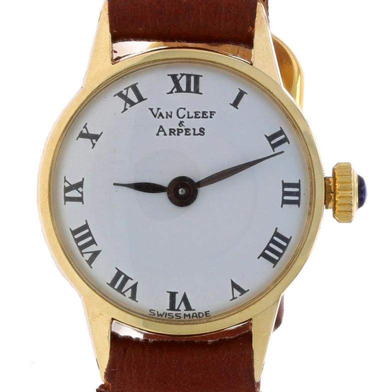 Brand: Van Cleef & Arpels
Movement: Manual
Number of Jewels: 17
Warranty: One Year
Era: Vintage
Movement Maker: Swiss
Dial Color: White

Metal Content: 14k Yellow Gold

Stone Information
Simulated Sapphire
Cut: Round Cabochon
Color: Blue
Stone Note: