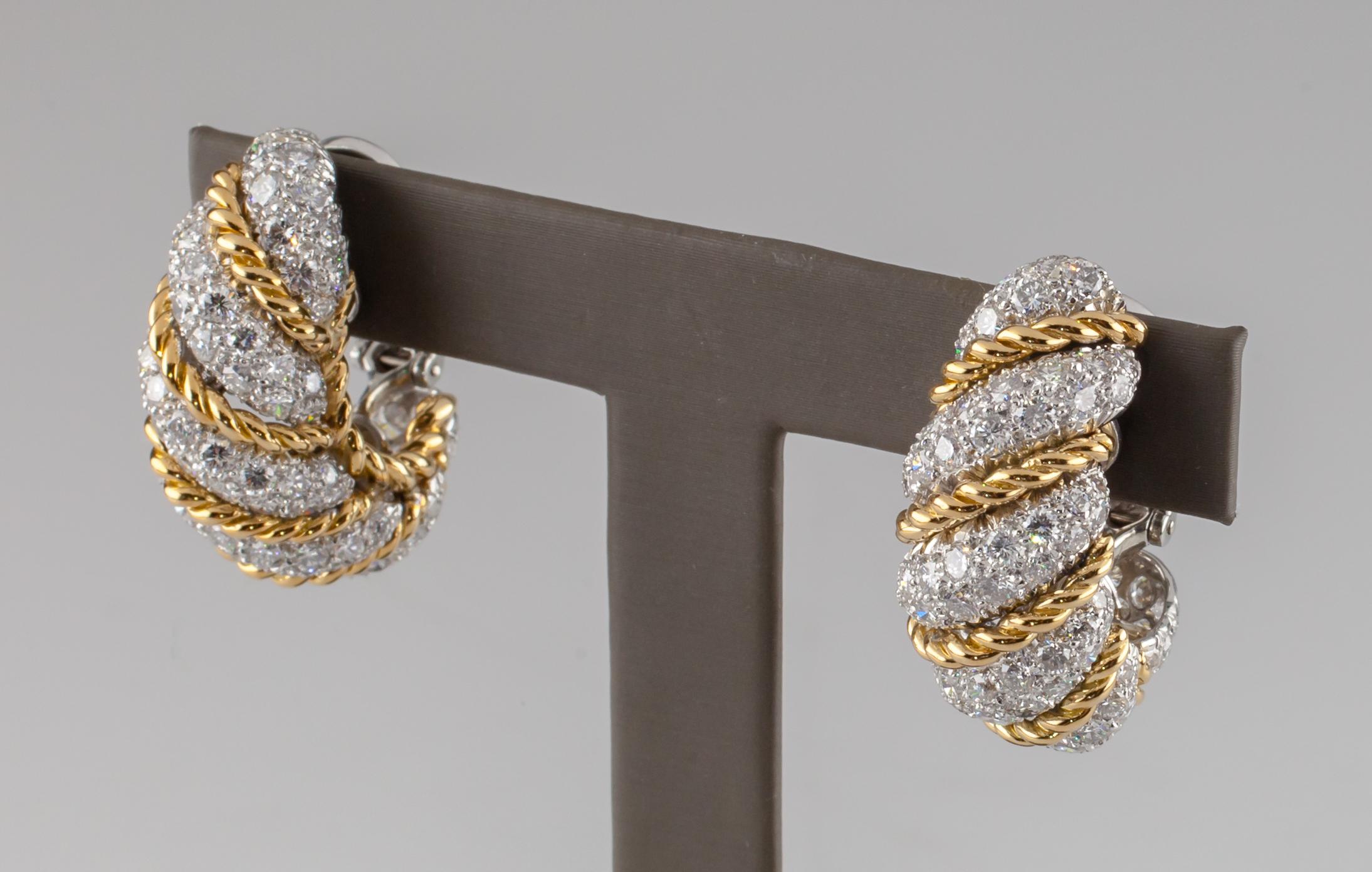 Gorgeous Vintage Earrings by Van Cleef & Arpels
Feature 18k Yellow Gold Twist Rope Accents Separating Pave-Set Round Diamond Segments in a Twist Pattern
Shrimp Huggie Earrings with Post and Omega Back
Hallmarked 