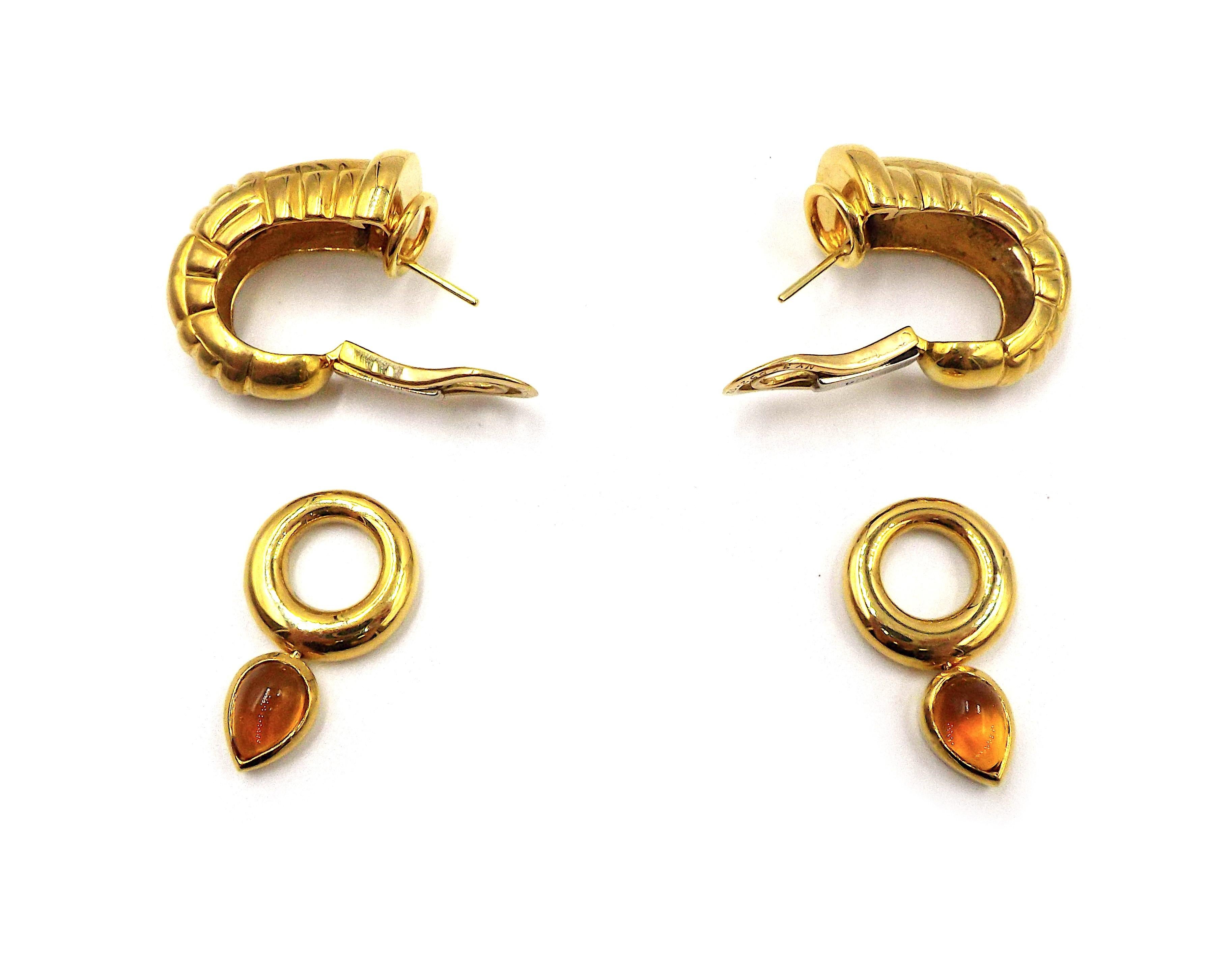 A pair of vintage gold hoop earrings by Van Cleef & Arpels. Smaller hoops with pear-shaped cabochon citrines are removable. Each earring weighs 14 grams, dimensions are 1 5/8
