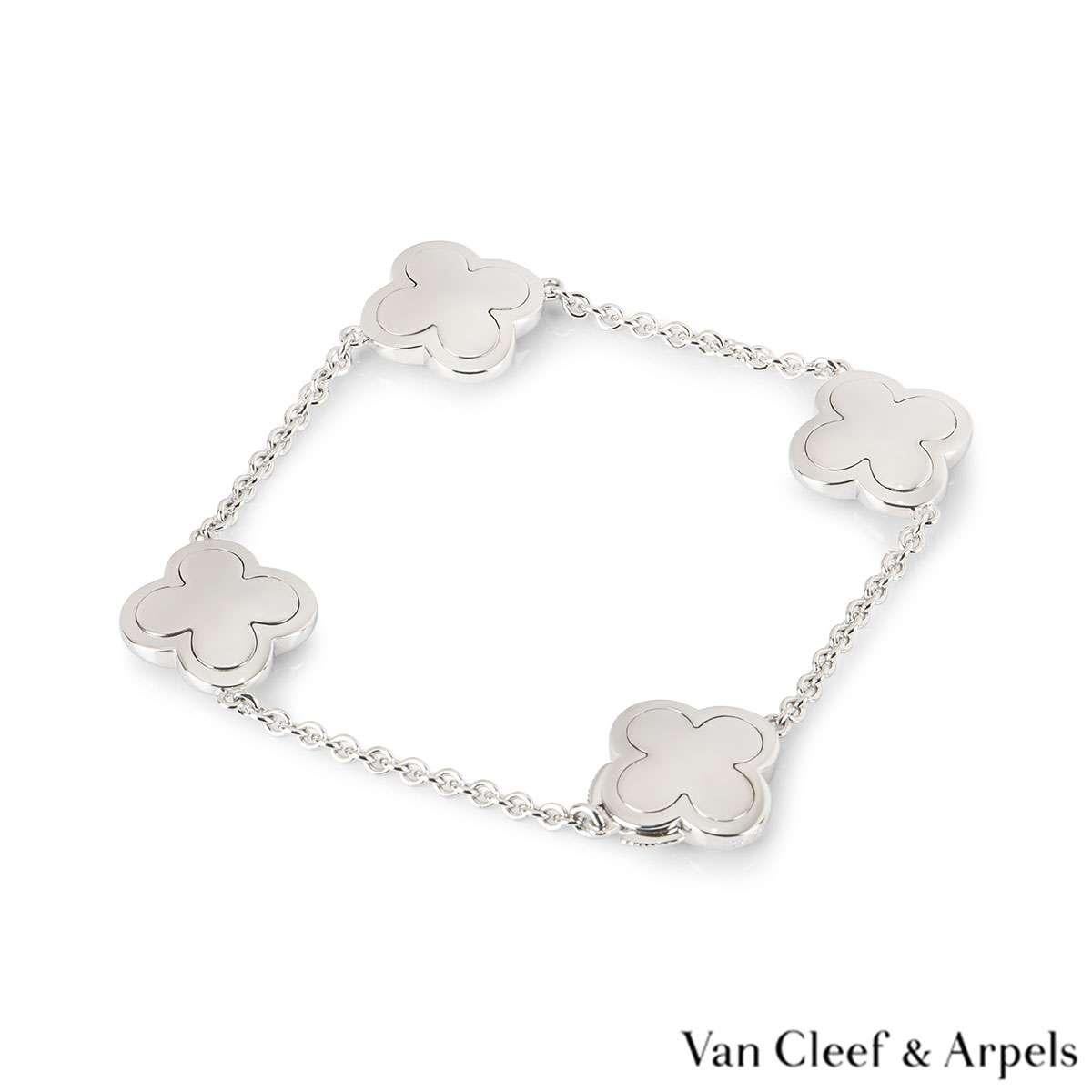 An iconic 18k white gold bracelet by Van Cleef & Arpels from the Alhambra collection. The bracelet consists of 4 iconic four leaf clover motifs in polished white gold set throughout the chain. The bracelet measures 7 inches in length and is complete