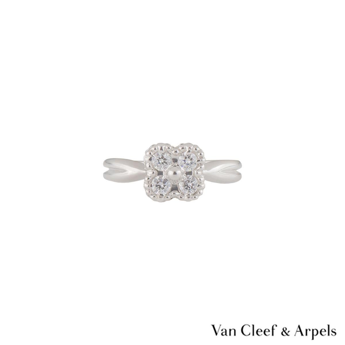 A lovely 18k white gold Van Cleef & Arpels diamond ring from the Alhambra collection. The central flower motif is set with 4 round round brilliant cut diamonds in a pave setting weighing approximately 0.28ct, G colour and VS clarity. The ring is