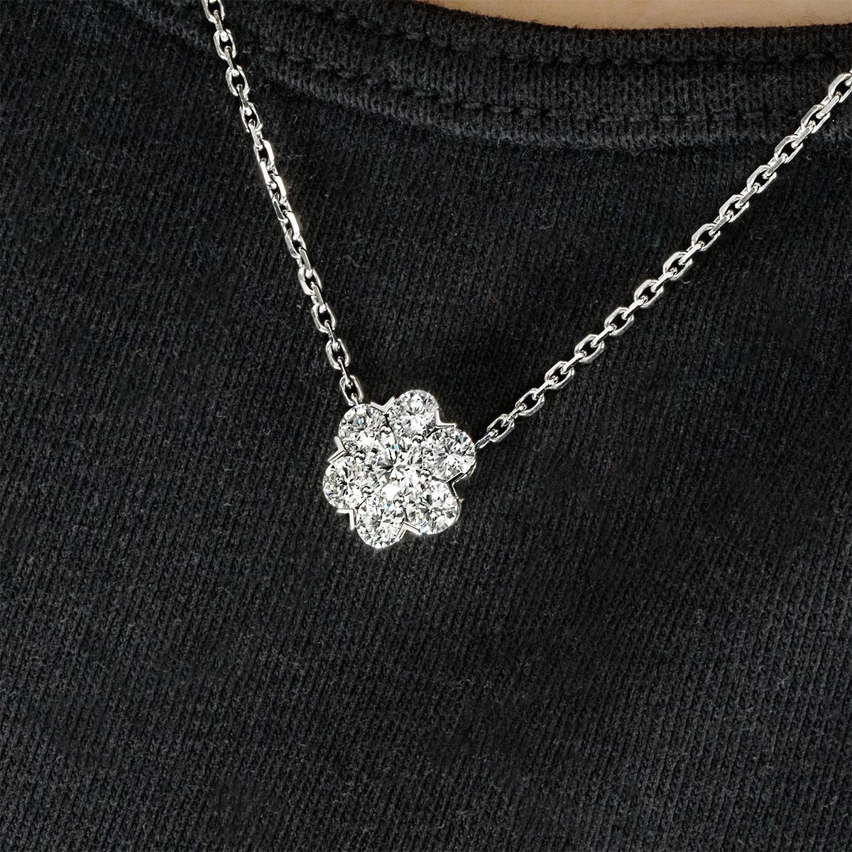 A stunning 18k white gold diamond Van Cleef & Arpels large model pendant from the Fleurette collection. The Fleurette motif is set with 7 round brilliant cut diamonds weighing a total of 0.94ct. Measuring 1cm in width, the motif suspends from a 16.5