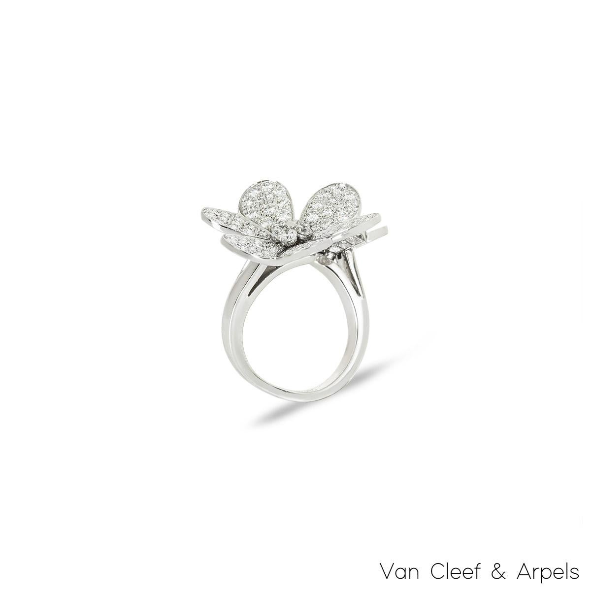 A stunning 18k white gold diamond ring by Van Cleef & Arpels from the Frivole collection. The ring comprises of 2 diamond set floral motifs varying in size. The 130 round brilliant cut diamonds have an approximate total weight of 2.40ct, D-F colour