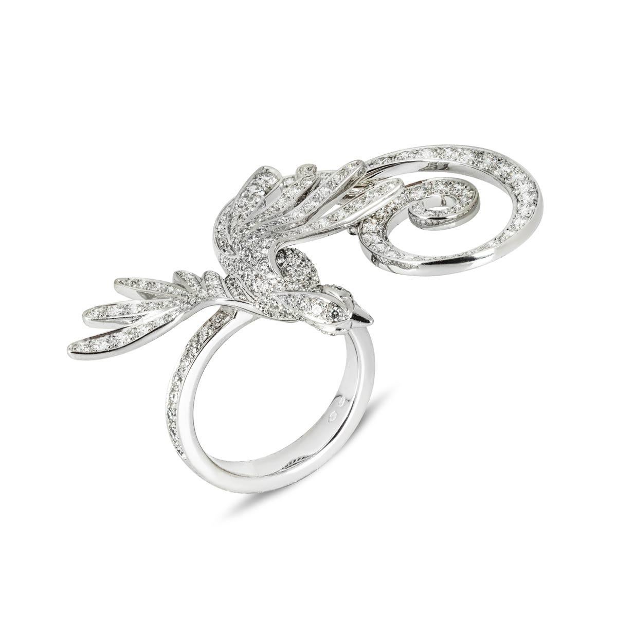 A stunning 18k white gold diamond ring by Van Cleef & Arpels from the Fauna Oiseaux de Paradis collection, released in 2012. The ring comprises of a bird (translates to oiseaux) motif, adorned with approximately 211 round brilliant cut diamonds that