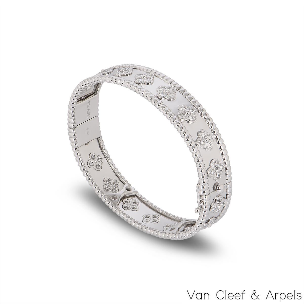 A stunning 18k white gold bracelet by Van Cleef & Arpels from the Perlée Clovers collection. The bracelet features 18 four leaf clover motifs, each set with 4 round brilliant cut diamonds, totalling approximately 1.61ct, D-F colour and IF-VVS