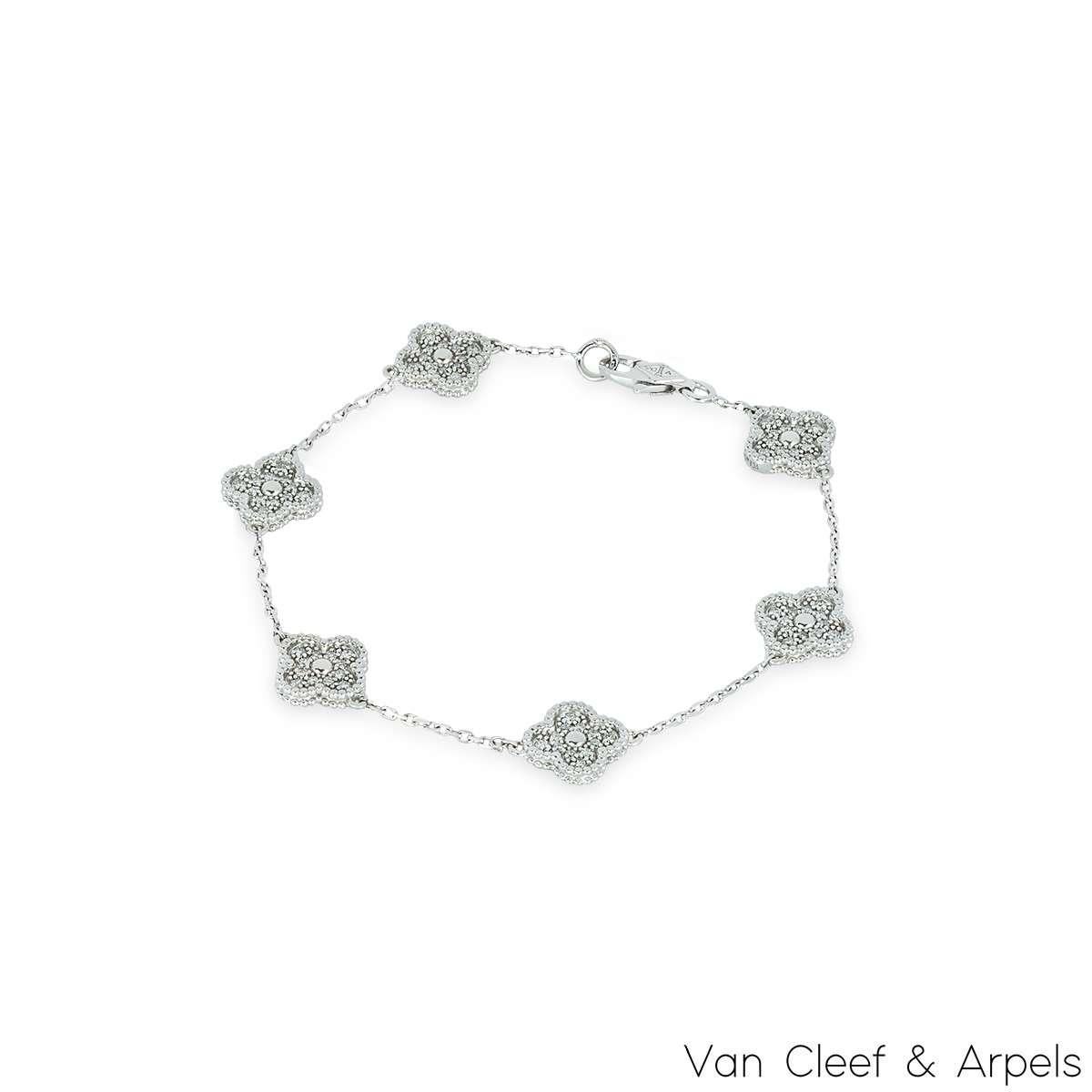 An 18k white gold bracelet by Van Cleef & Arpels from the Sweet Alhambra Collection. Comprises of 6 iconic 4-leaf clover motifs, each pave set with a diamond inlay, complimented by a beaded edge. The 72 diamonds have a total weight of ~0.48ct. The