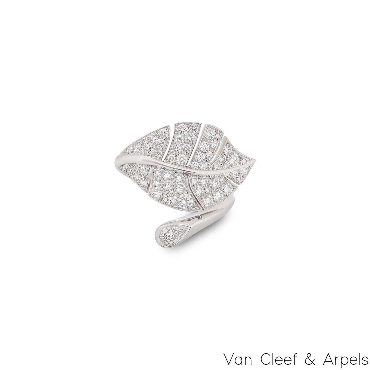 An 18k white gold diamond leaf ring by Van Cleef & Arpels from the Virevolte collection. The between the finger ring takes the form of a leaf which features a swivel mechanism that allows the leaf to be worn either open or closed. The ring is set