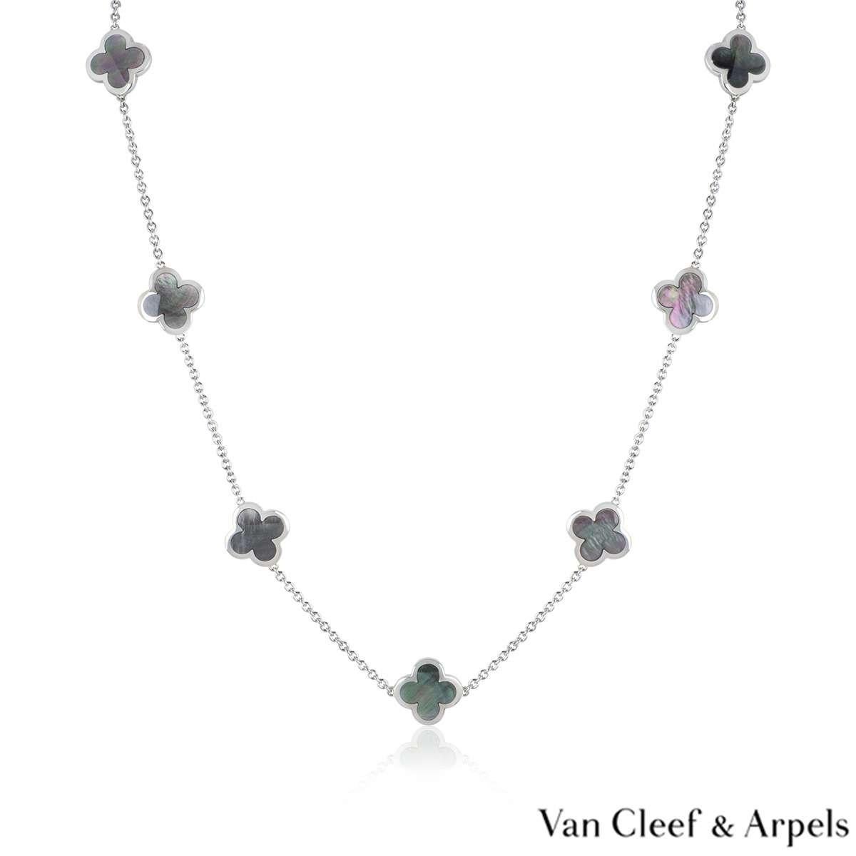 An 18k white gold Pure Alhambra necklace by Van Cleef & Arpels. The necklace is composed of 14 iconic four leaf clover motifs, set to the centre with grey mother of pearl inlays and a polished outer edge. The necklace measures 32 inches in length