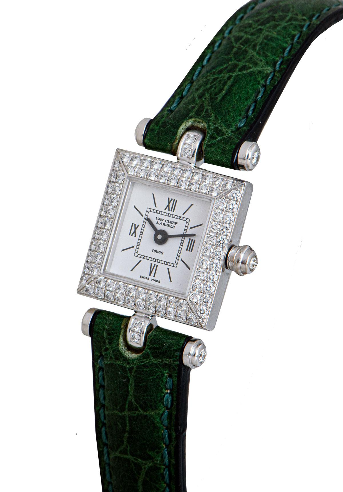 A 17 mm 18k White Gold Ladies Dress Wristwatch, silver dial with hour markers and roman numerals III, VI, IX and XII, a fixed 18k white gold bezel set with approximately 80 round brilliant cut diamonds, an 18k white gold crown set with a single