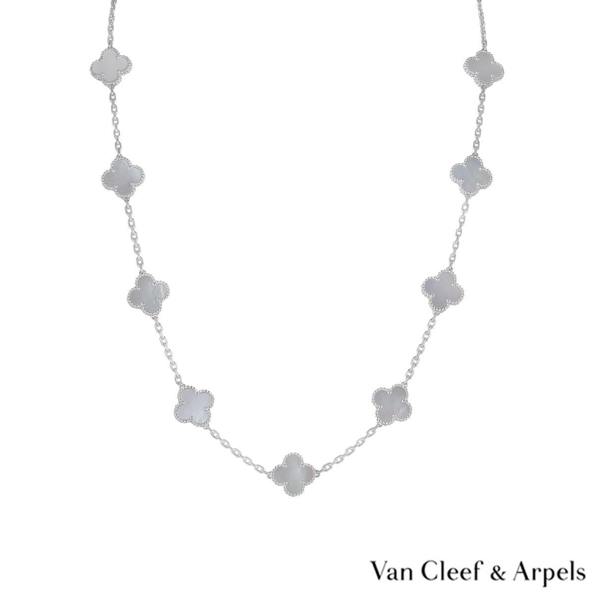 An 18k white gold necklace by Van Cleef & Arpels from the Vintage Alhambra collection. The necklace features 20 iconic 4 leaf clover motifs, each set with a beaded edge and a mother of pearl inlay, set throughout the length of the chain. The trace