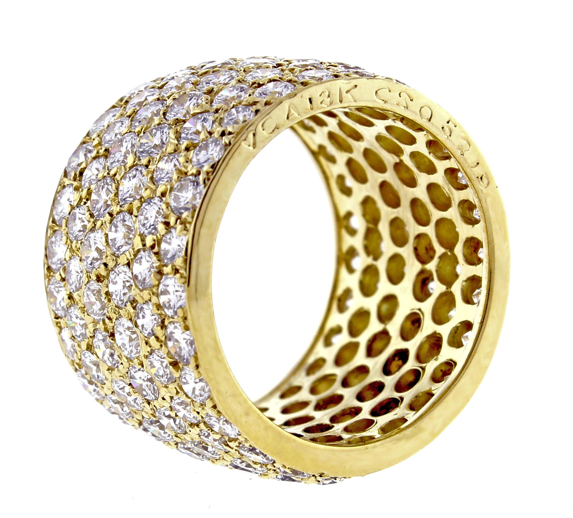 From Van Cleef & Arpels  a six row diamond band-ring. The  18 karat yellow gold ring contains 156 diamonds weighing approximately 7 carats The diamond are F-G color and VVS clarity, The ring is 13.7mm  ( just over ½ inch) wide. Size 6, Fits a size 5