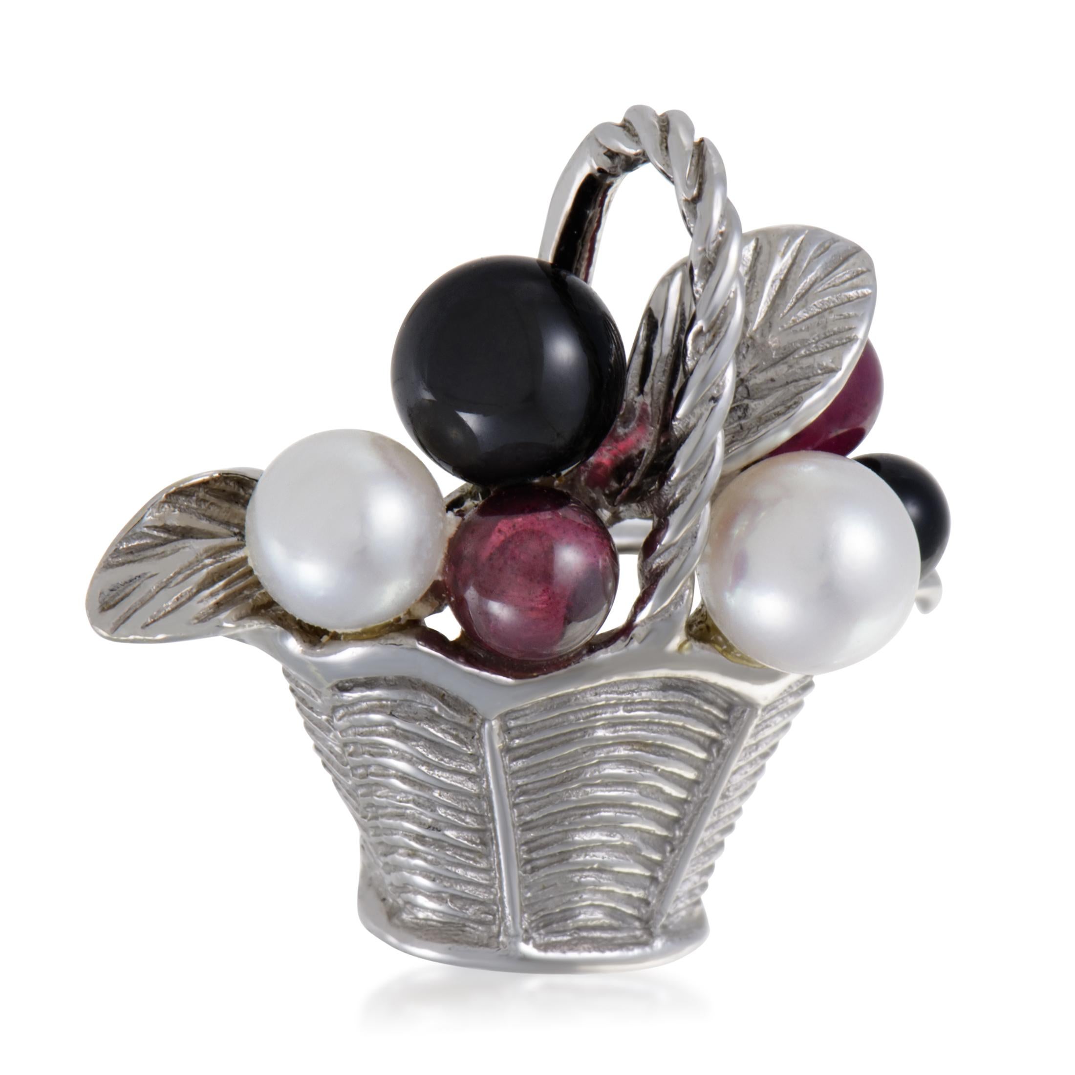 Ideally spherical and tastefully combined, the charming pink tourmalines, stunning onyx stones and delightful pearls are placed in an intricately textured basket of 18K white gold in this adorable brooch from Van Cleef & Arpels.
