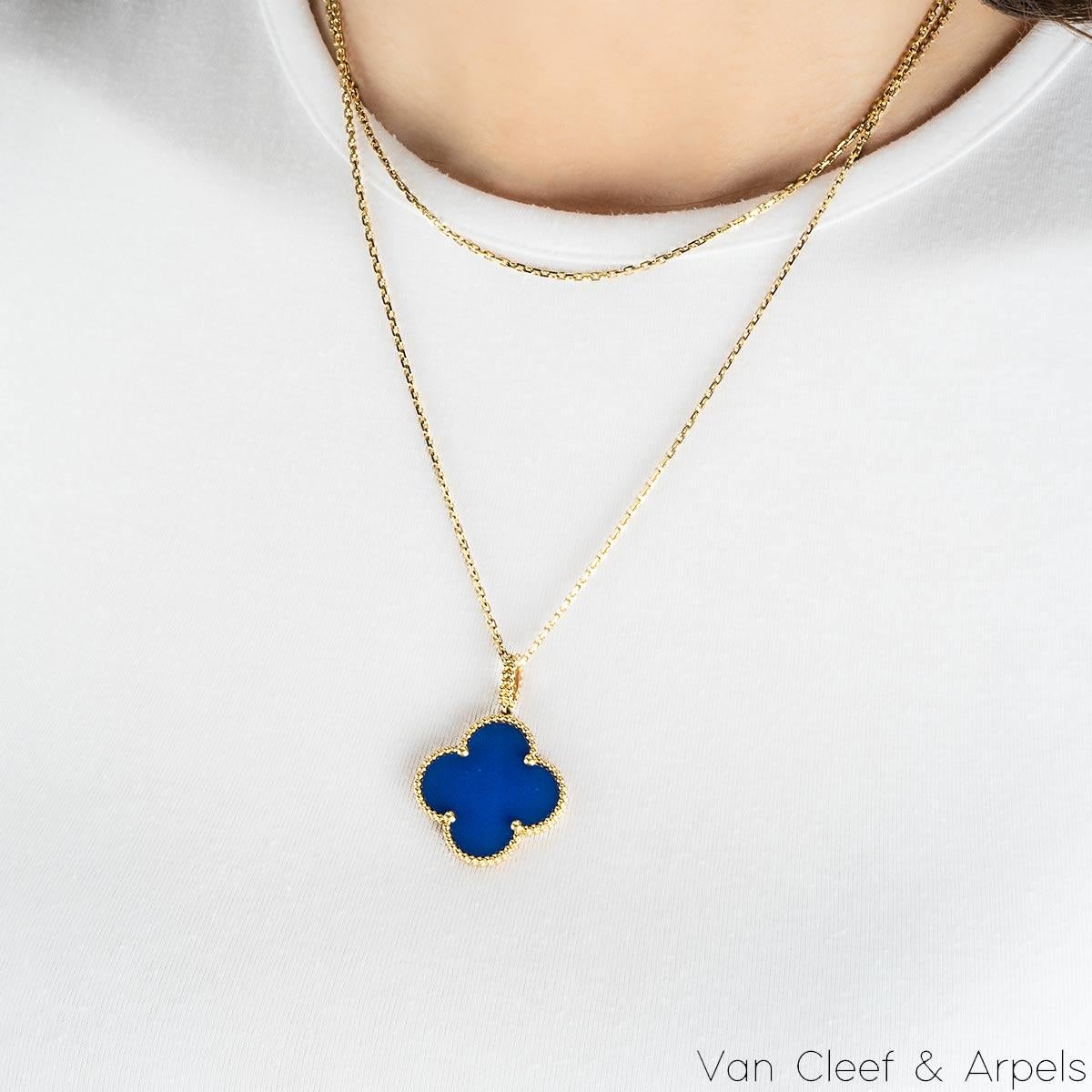 A gorgeous 18k yellow gold agate long necklace by Van Cleef & Arpels from their Magic Alhambra collection. The necklace comprises of the iconic 4-leaf clover motif pendant set with an agate inlay, complemented by a beaded edge. Measuring 2.6cm in