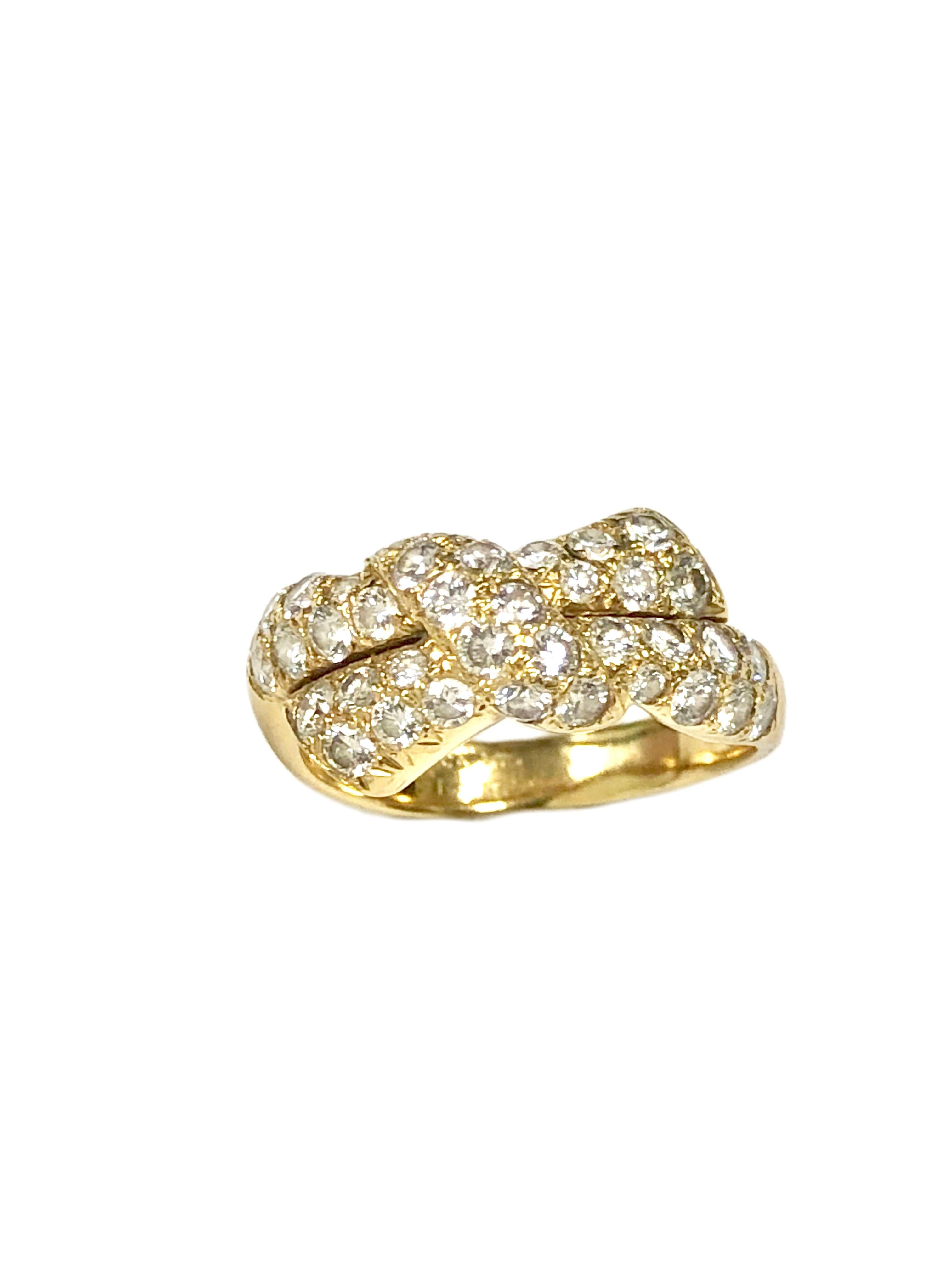 Circa 2004 Van Cleef & Arpels 18k Yellow Gold Bow form Ring, the top of the ring measures 3/4 inch in length X 5/16 inch, set with Fine White Round Brilliant cut Diamonds totaling approximately 1 Carat. Finger size 7 1/4. Signed, numbered and comes