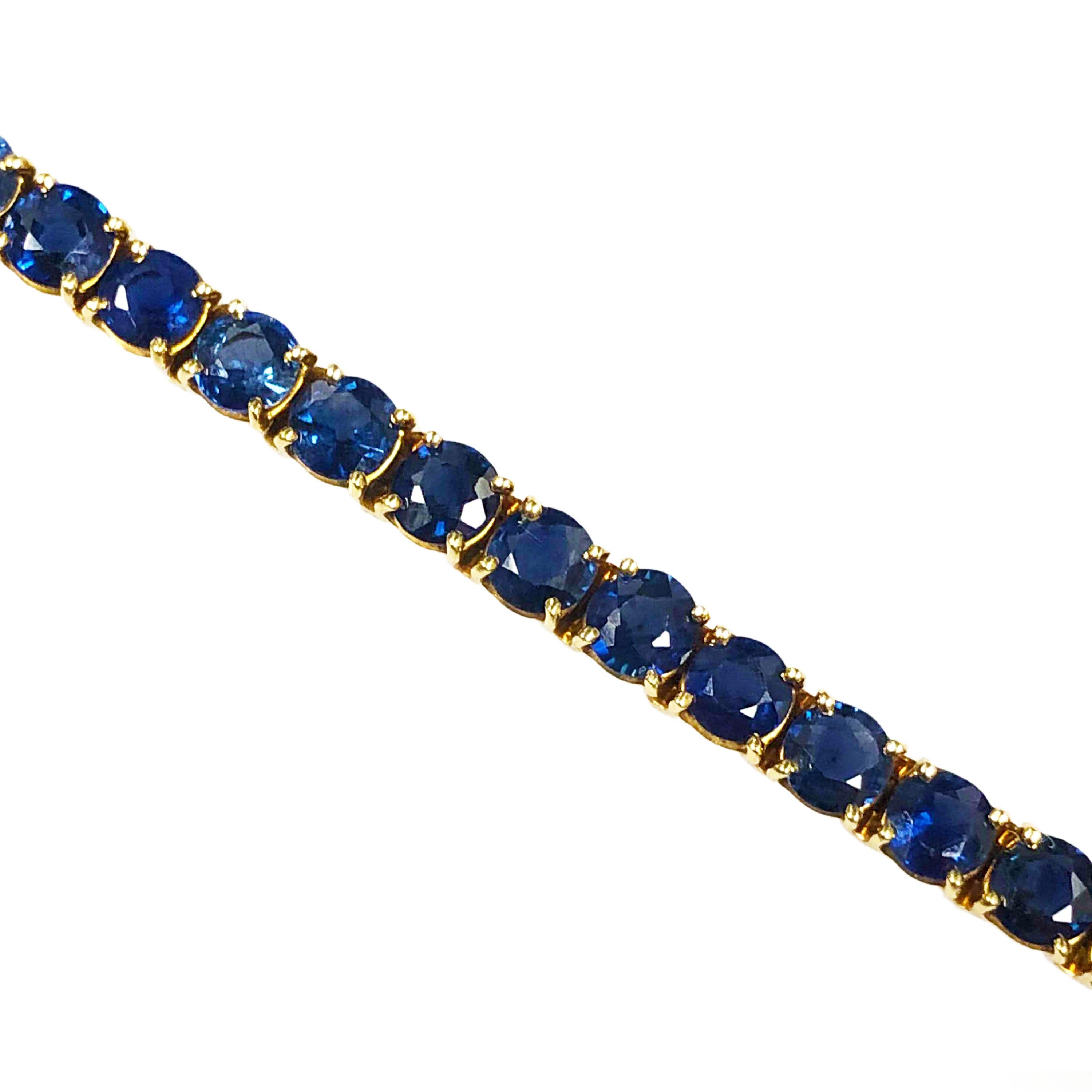 Circa 1970s VCA Van Cleef & Arpels 18K Yellow Gold Tennis, Line Bracelet, measuring 6 1/2 inches in length and 3/16 inch wide. Set with Fine Color Sapphires totaling 4 Carats. 