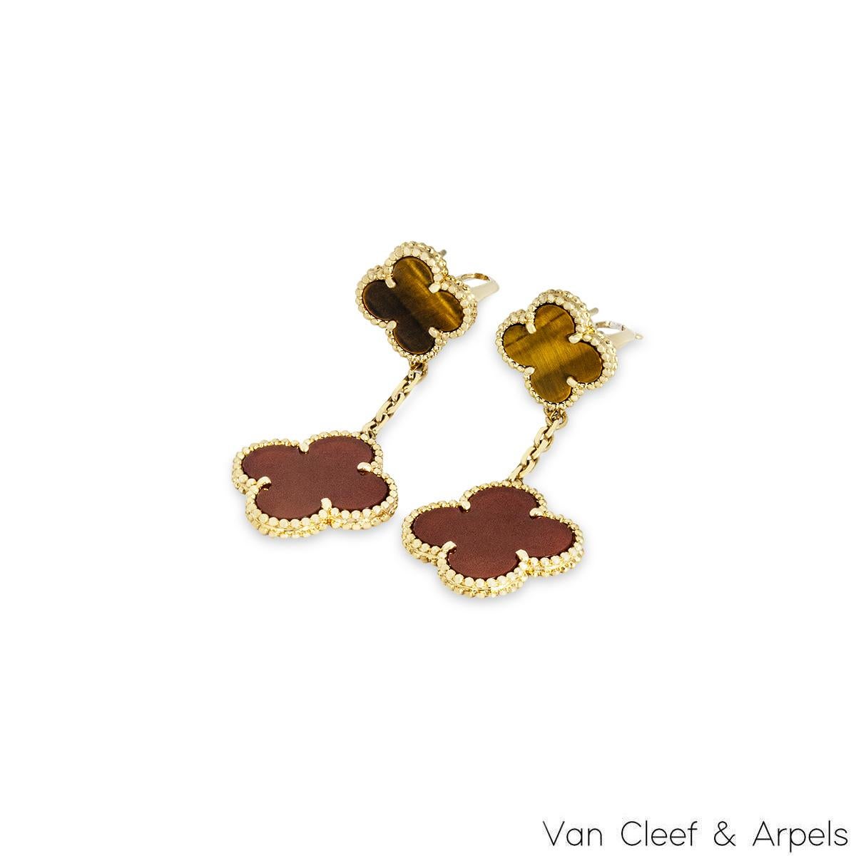 An iconic pair of 18k yellow gold earrings by Van Cleef & Arpels, from the Magic Alhambra collection. Comprising of 2 four-leaf clover motifs alternating in size complemented by a beaded outer edge, the first motif is set with carnelian and the next