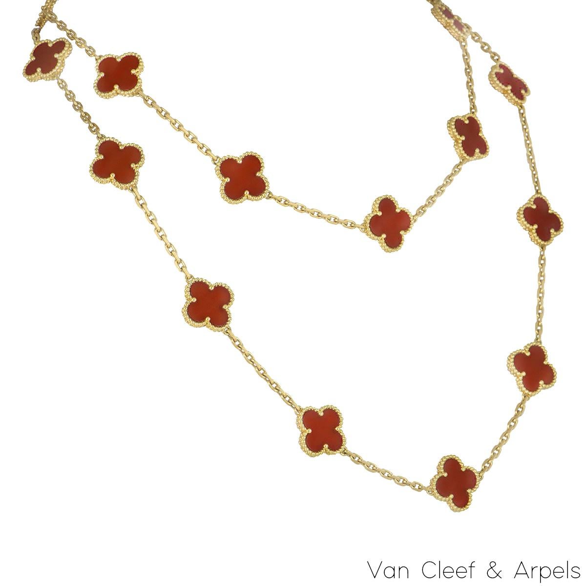 A beautiful 18k yellow gold carnelian necklace from the Vintage Alhambra collection by Van Cleef & Arpels. Featuring 20 iconic clover motifs, each motif is set with a beaded edge and a carnelian inlay, set throughout the length of the necklace. The