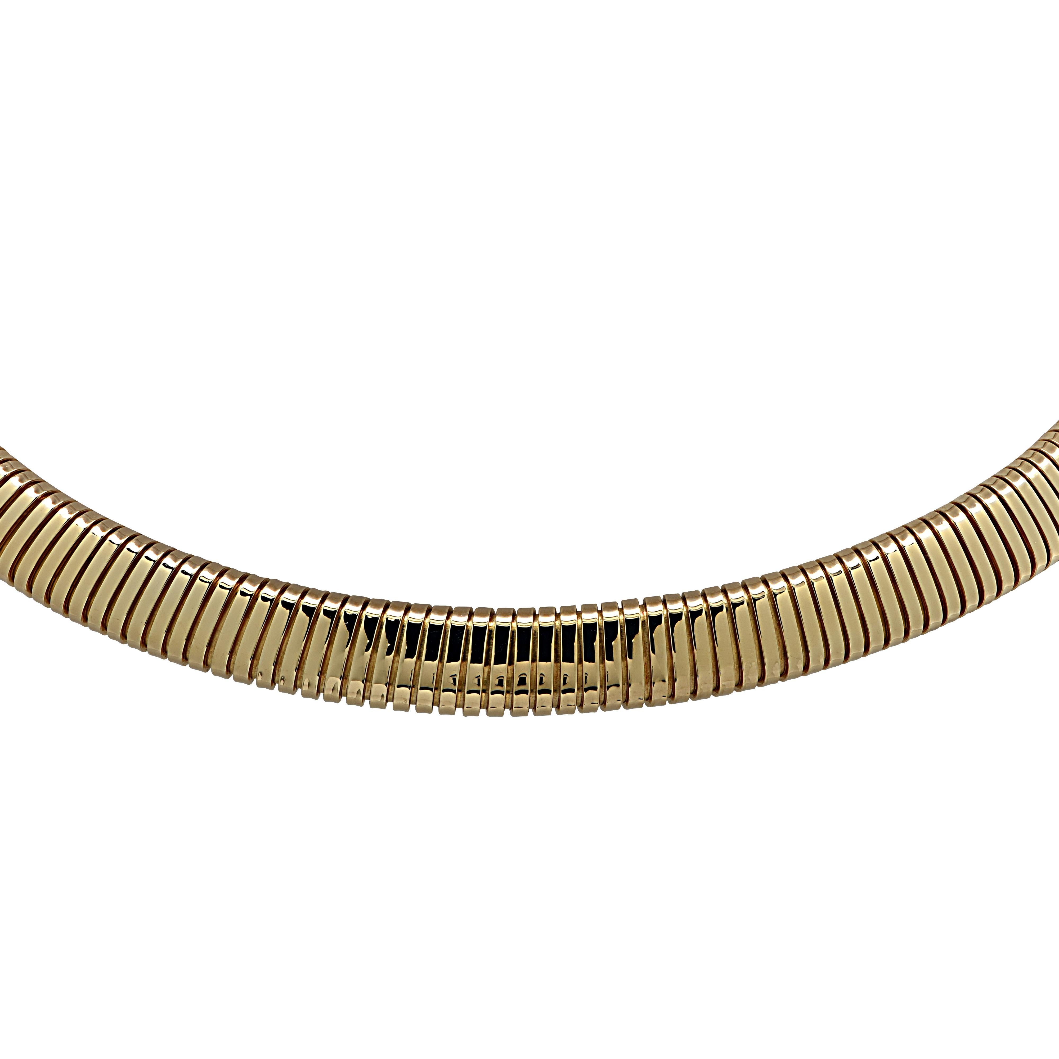 From the legendary House of Van Cleef & Arpels, this timelessly elegant collar necklace, crafted in 18 karat yellow gold, glides smoothly around the neck and rests silkily on the collar bone. This necklace threads into a highly polished gold plate