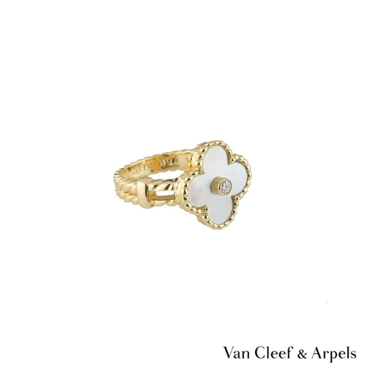 A beautiful 18k yellow gold Van Cleef & Arpels ring from the Alhambra collection. The ring is composed of a four leaf clover motif with a mother of pearl insert set to the centre, complimented by a beaded edge and a round brilliant cut diamond