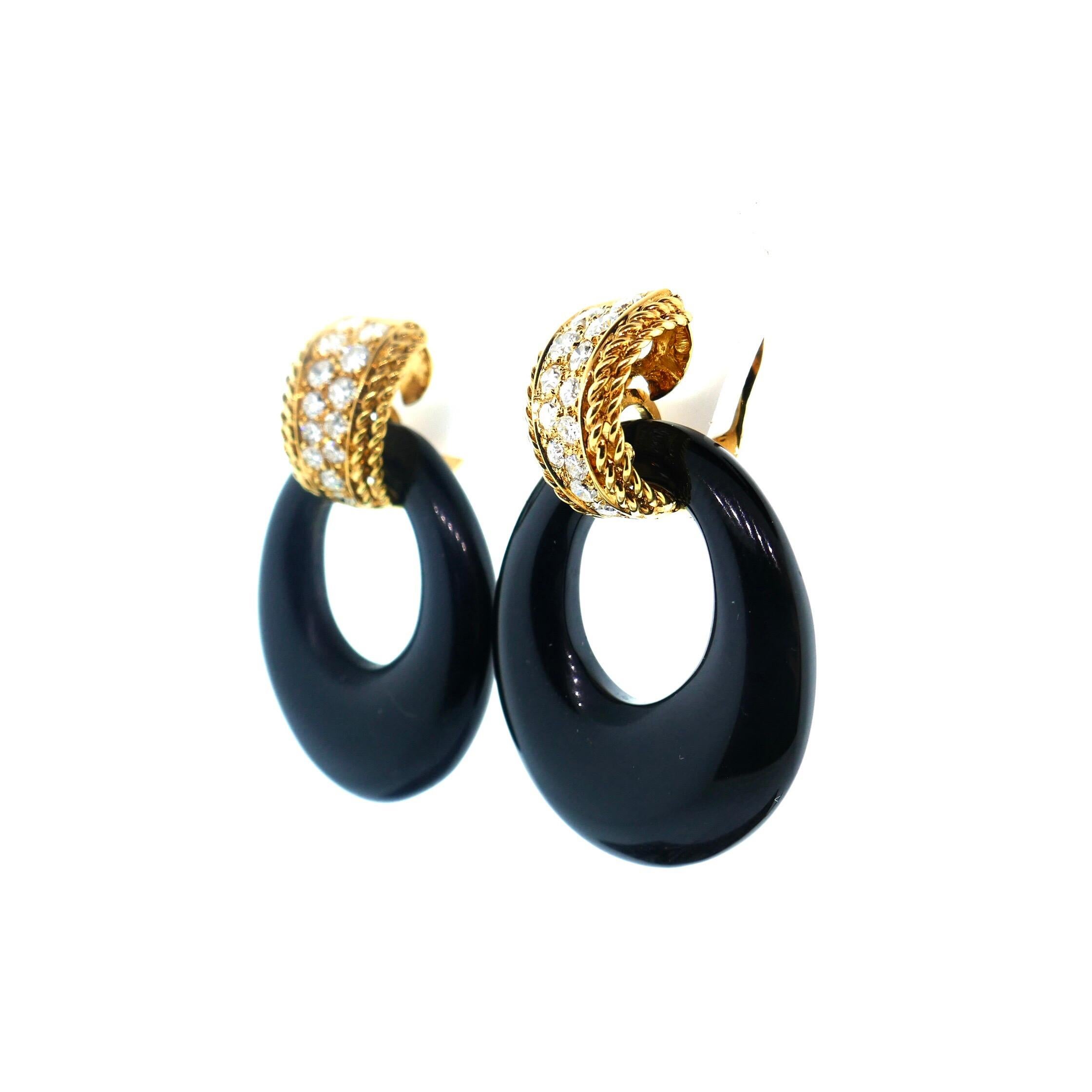 Van Cleef & Arpels Yellow Gold Diamond and Onyx Door Knocker Earrings

These rare vintage Van Cleef & Arpels clip-back earrings are crafted in 18k yellow gold and accented with brilliant-cut round diamonds (over one carat) and black onyx hoops. Made