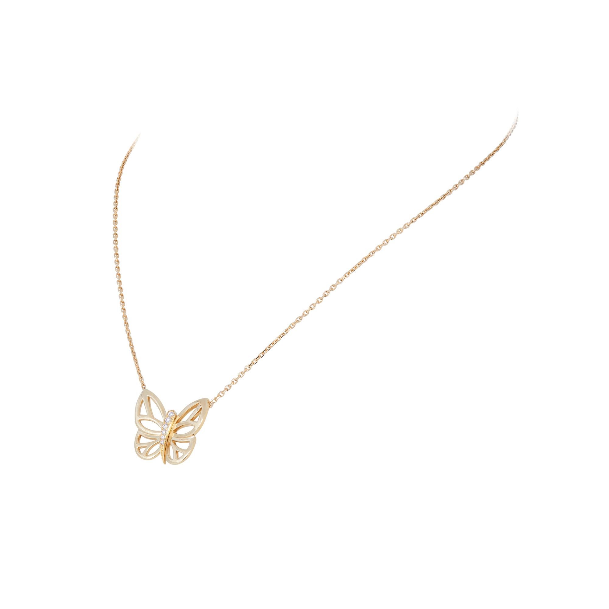 Authentic Van Cleef & Arpels Butterfly pendant necklace crafted in 18 karat yellow gold.  The body of the butterfly is set with 6 round brilliant cut diamonds of approximately 0.10 total carats.  The pendant is situated on a 16 3/4 inch adjustable