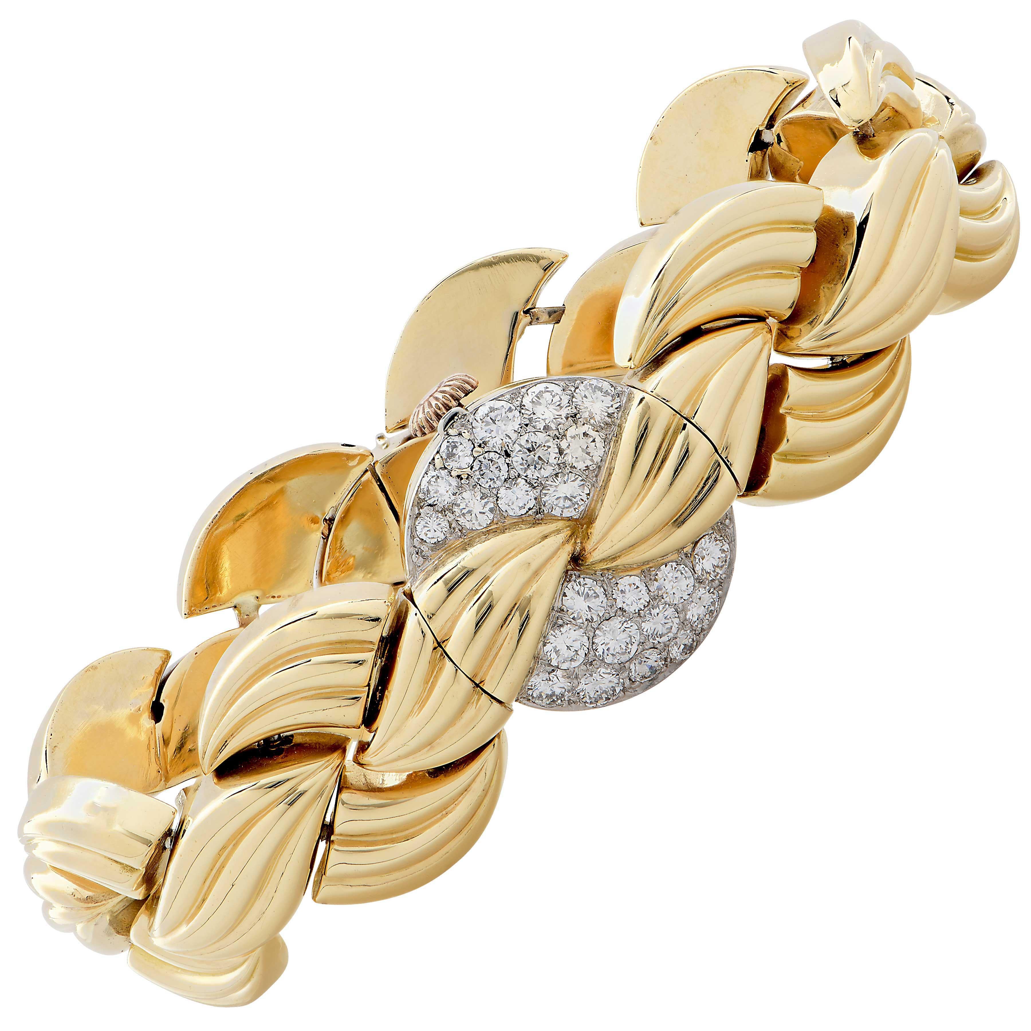 Van Cleef & Arpels diamond and gold bracelet watch. 

Length 6 1/2.