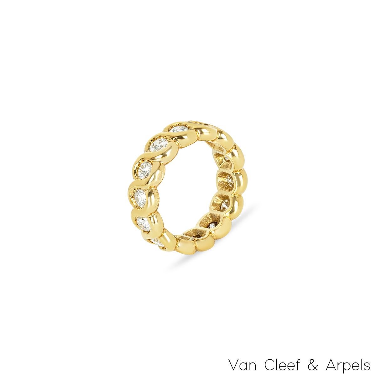 A beautiful 18k yellow gold Van Cleef & Arpels diamond eternity ring. The ring comprises of 14 round brilliant cut diamonds in a rubover setting, set all the way around the ring. The diamonds have a total weight of 1.40ct,, G colour and VS clarity.
