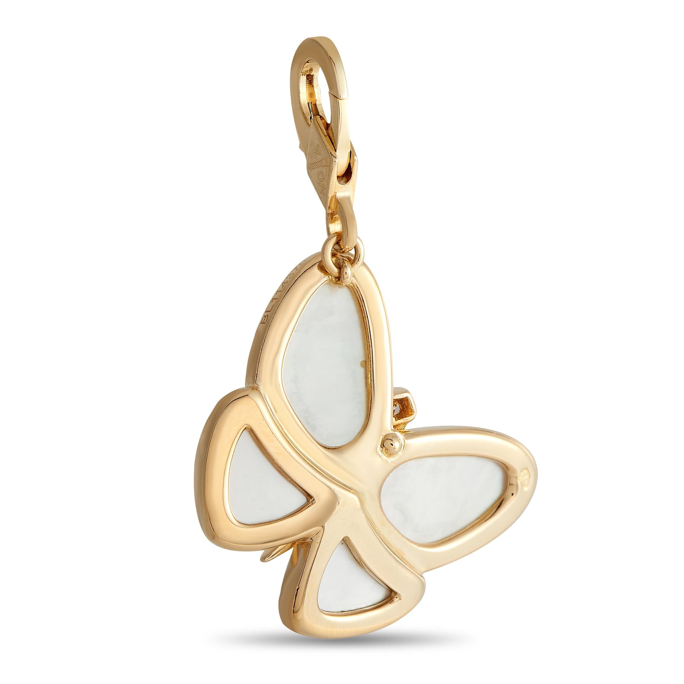 Exuding femininity and elegance, this Van Cleef & Arpels pendant charm will instantly take your style to new heights. It features a graceful butterfly silhouette in 18K yellow gold, with a body traced with diamonds and wings inlaid with