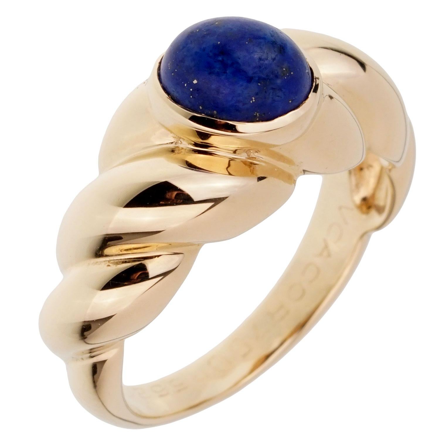 A fabulous vintage Van Cleef & Arpels ring set with a cabochon oval Lapis stone in 18k yellow gold. The ring measures a size 6 1/4 and can be resized.