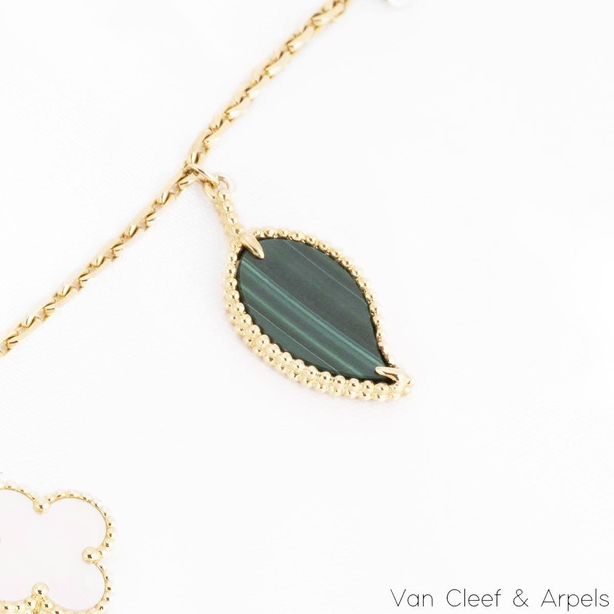 A lovely 18k yellow gold, Lucky Alhambra bracelet by Van Cleef & Arpels. The bracelet features a malachite leaf motif, a mother of pearl clover motif, a tiger's eye butterfly motif and a carnelian heart motif. Measuring 7.5 inches in length, the