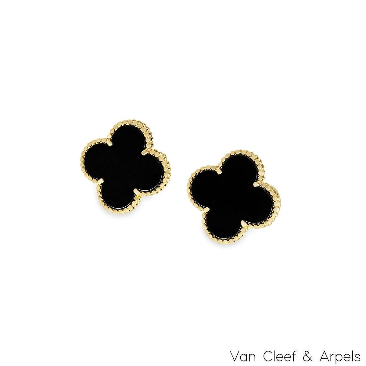 An iconic pair of 18k yellow gold Van Cleef & Arpels earrings from the Magic Alhambra collection. The earrings are composed of a four leaf clover motif with an onyx inlay, complimented by a beaded edge. The 19.5mm wide earrings feature removable