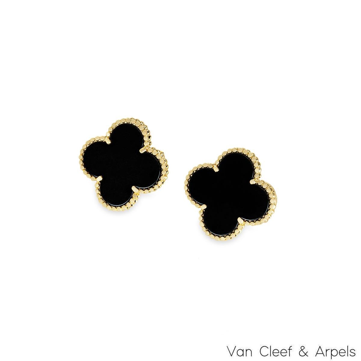 An iconic pair of 18k yellow gold Van Cleef & Arpels earrings from the Magic Alhambra collection. The earrings are composed of a four-leaf clover motif with an onyx inlay, complimented by a beaded edge. The 20.00 mm wide earrings feature removable