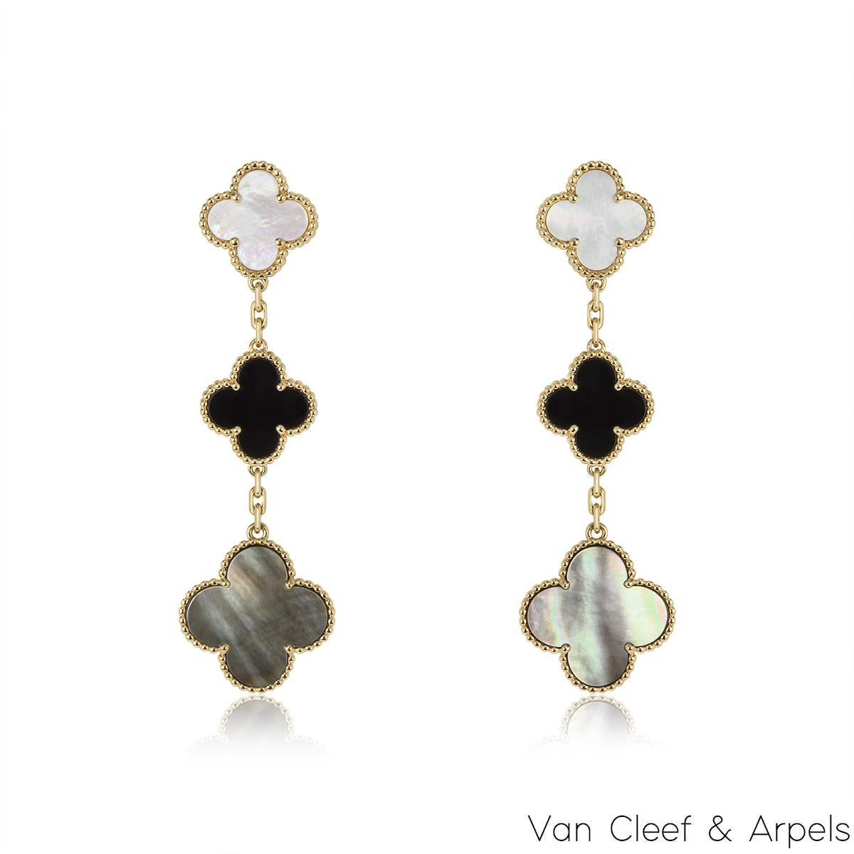 An iconic pair of 18k yellow gold earrings by Van Cleef & Arpels from the Magic Alhambra collection. The earrings comprise of 3 four leaf clover motifs alternating in size complimented by a beaded outer edge each individually set with onyx, grey and