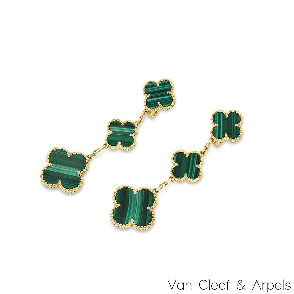 A marvellous pair of 18k yellow gold earrings by Van Cleef & Arpels from the Magic Alhambra collection. The earrings comprise of 3 four leaf clover motifs alternating in size complimented by a beaded outer edge each individually set with malachite