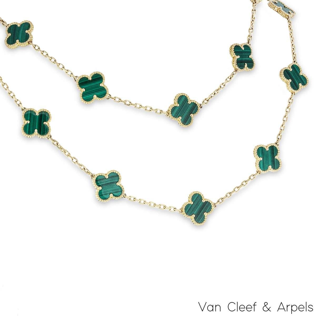 An iconic 18k yellow gold long necklace by Van Cleef & Arpels, from the Vintage Alhambra collection. Featuring 20 of the iconic 4-leaf clover motifs, each set with a beaded edge and a malachite inlay throughout the length of the necklace. The trace