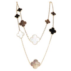 Van Cleef & Arpels Yellow Gold Mother Of Pearl and Onyx Magic Alhambra 16 Motif