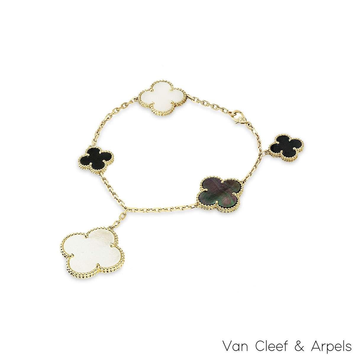 An iconic 18k yellow gold bracelet by Van Cleef & Arpels, from the Magic Alhambra collection. Comprising of 5 four-leaf clover motifs alternating in size complemented by a beaded outer edge, each individually set with onyx as well as white and grey