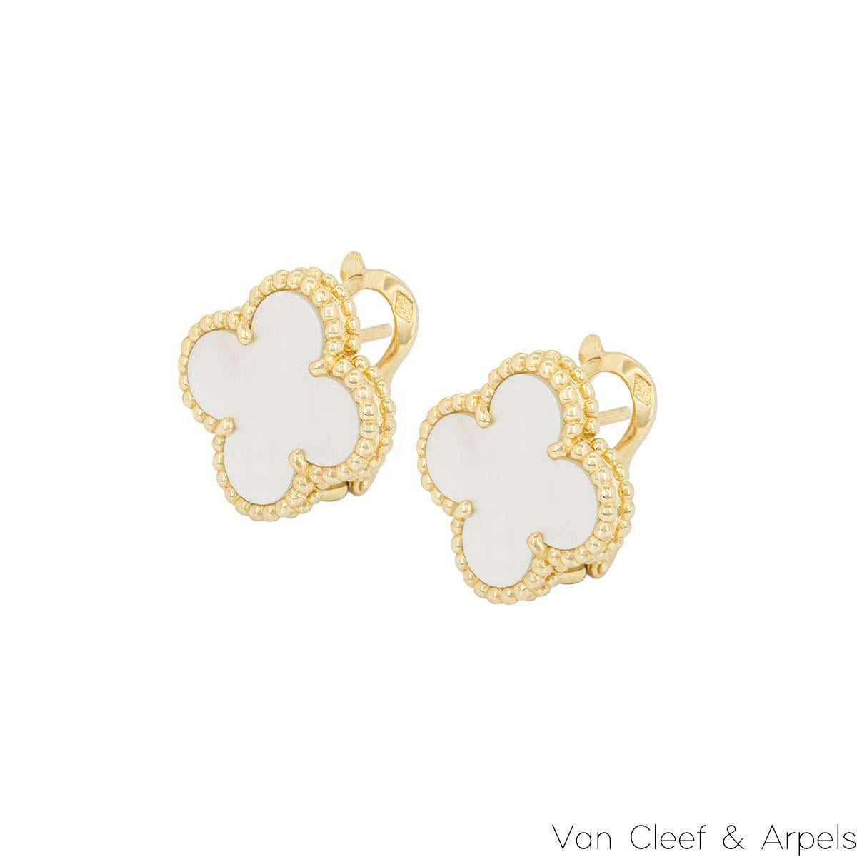 A beautiful pair of 18k yellow gold mother of pearl Van Cleef & Arpels earrings from the Vintage Alhambra collection. The earrings feature the iconic 4-leaf clover motif, with a mother of pearl inlay set to the centre, complemented by a beaded edge.