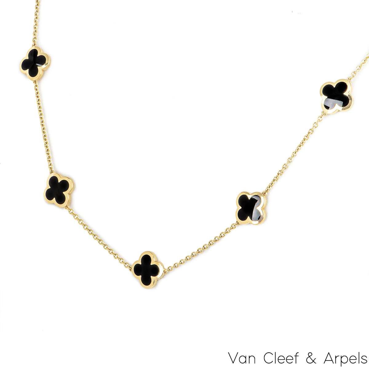 A beautiful 18k yellow gold Pure Alhambra necklace by Van Cleef & Arpels. The necklace is composed of 9 iconic four leaf clover motifs, set to the centre with onyx inlays and a polished outer edge. The necklace measures 16 inches in length, finishes