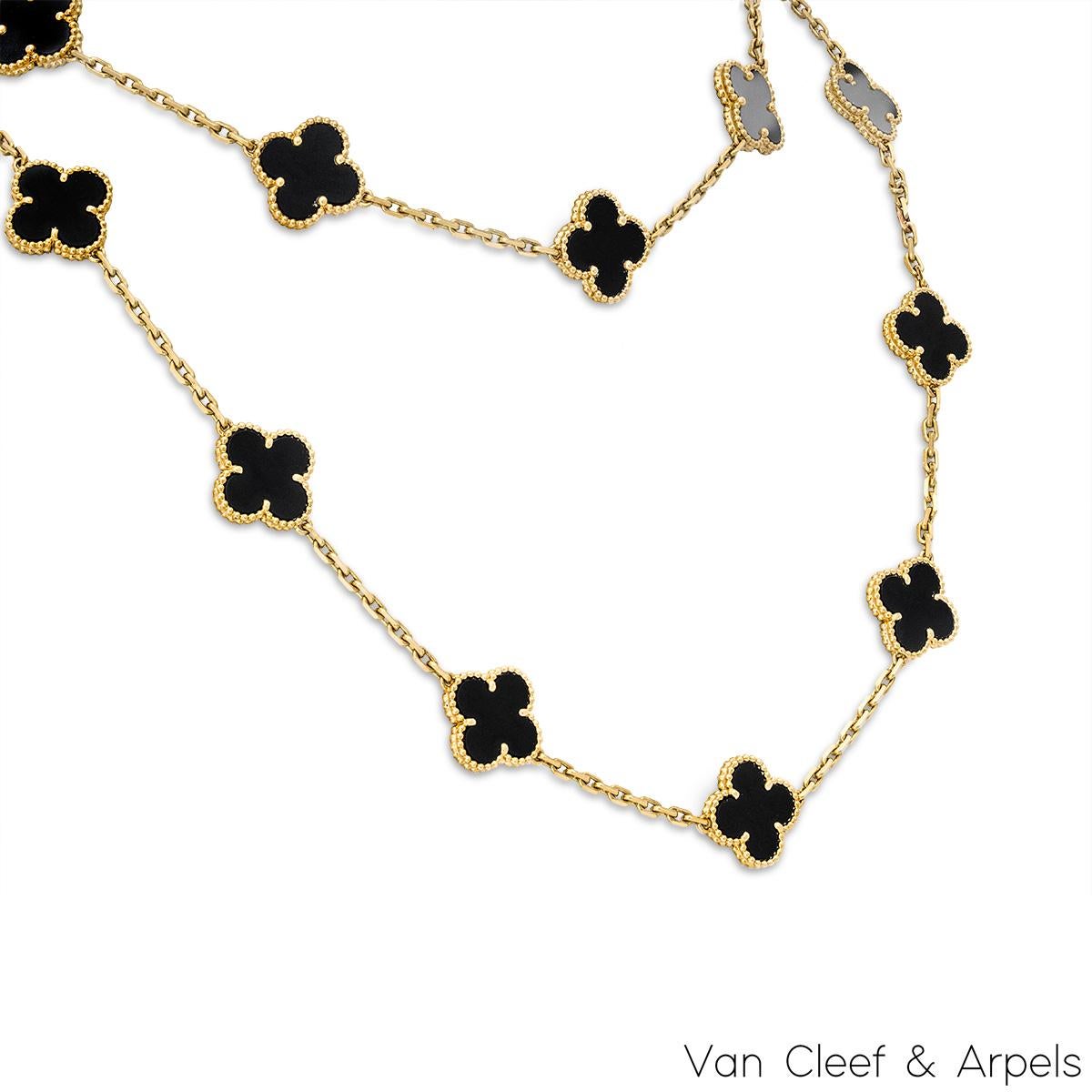 A gorgeous 18k yellow gold necklace by Van Cleef & Arpels from the Vintage Alhambra collection. The necklace features 20 iconic 4 leaf clover motifs, each set with a beaded edge and an onyx inlay, set throughout the length of the chain. The trace