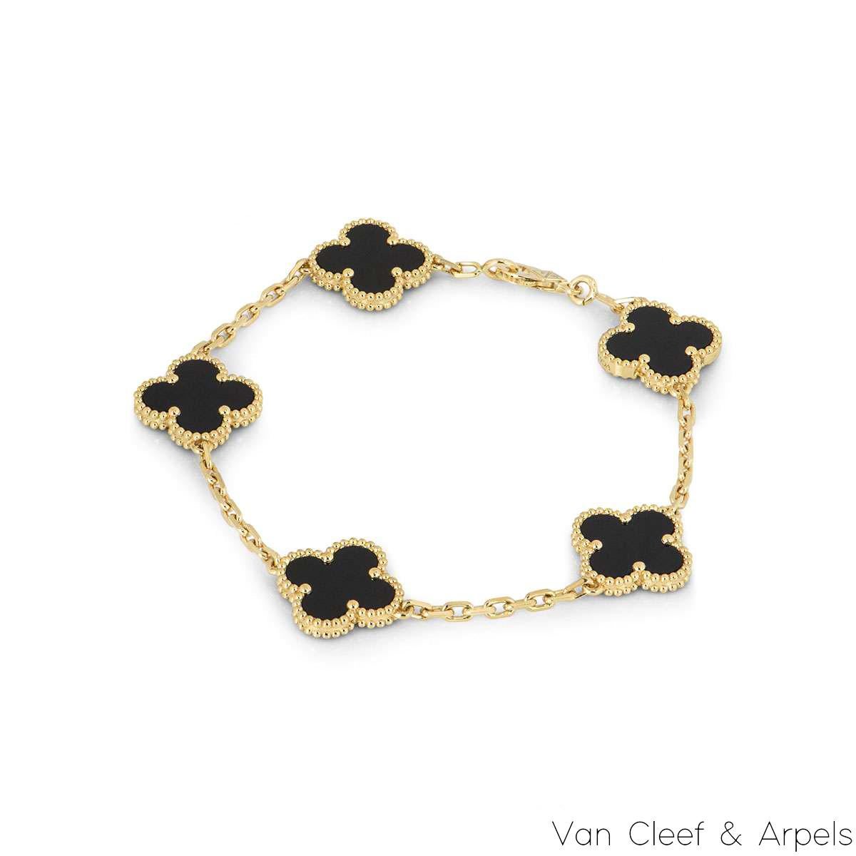 A timeless 18k yellow gold onyx bracelet, from the Vintage Alhambra collection by Van Cleef and Arpels. The bracelet is made up of 5 iconic clover motifs, each set with a beaded edge and a black onyx inlay. Measuring 7.5 inches in length, the