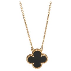 Ciondolo Van Cleef & Arpels in oro giallo con onice vintage Alhambra