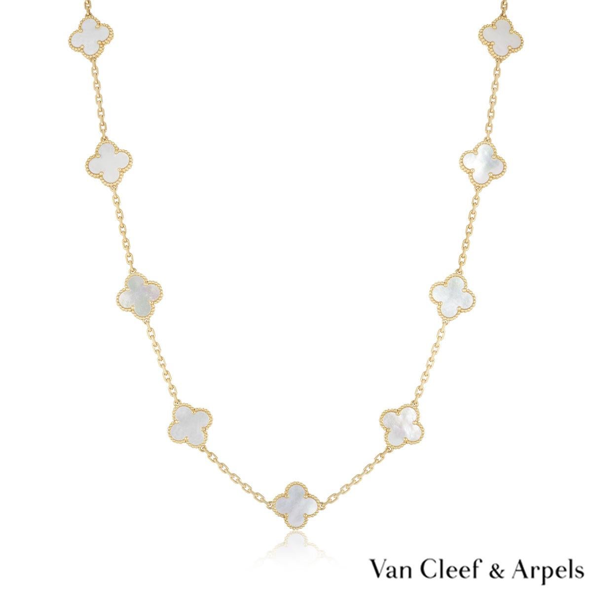 An 18k yellow gold necklace from the Vintage Alhambra collection by Van Cleef & Arpels. The necklace features 20 iconic 4 leaf clover motifs, each set with a beaded edge and a mother of pearl inlay, set throughout the length of the chain. The trace