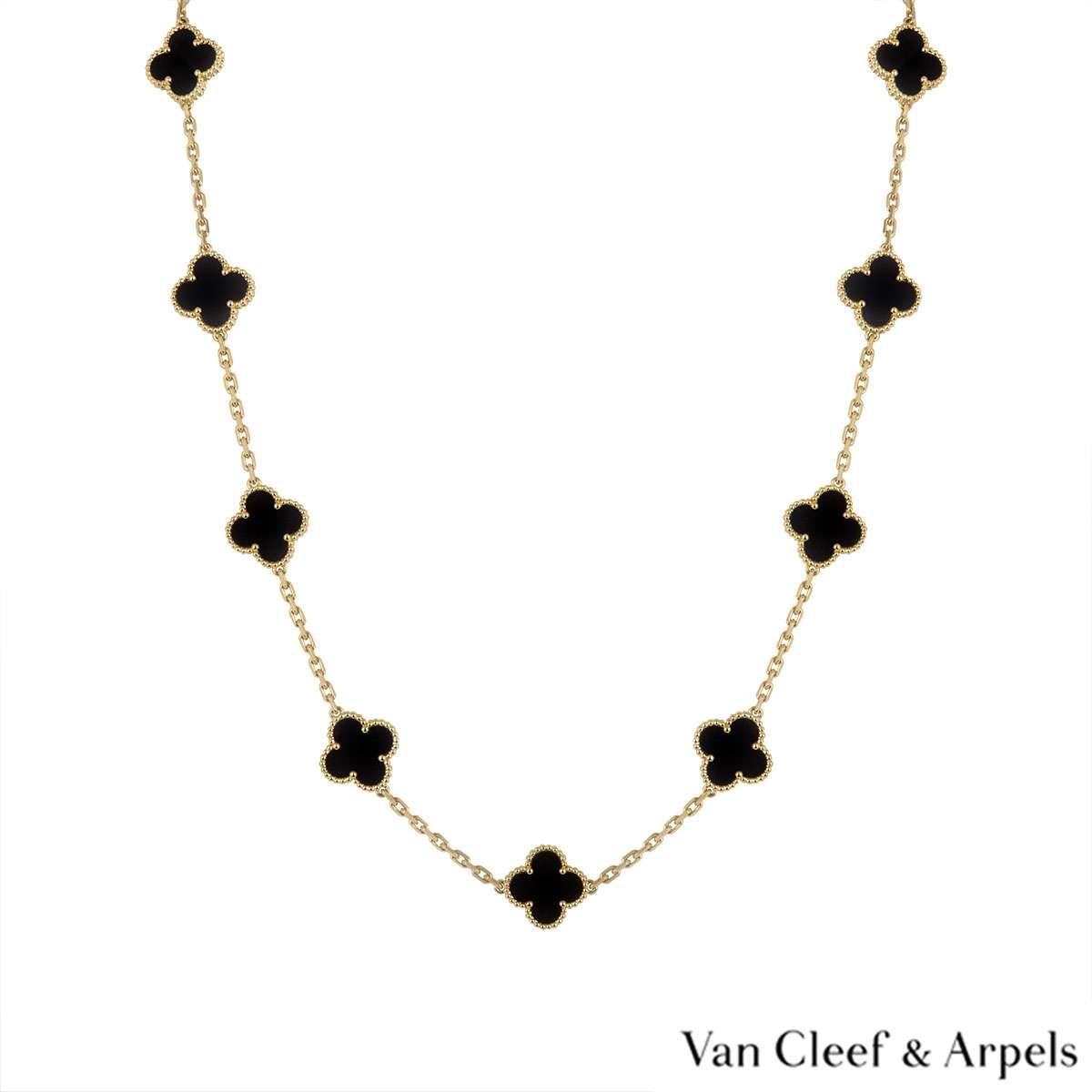An 18k yellow gold necklace by Van Cleef & Arpels from the Vintage Alhambra collection. The necklace features 20 iconic 4 leaf clover motifs, each set with a beaded edge and an onyx inlay, set throughout the length of the chain. The trace link