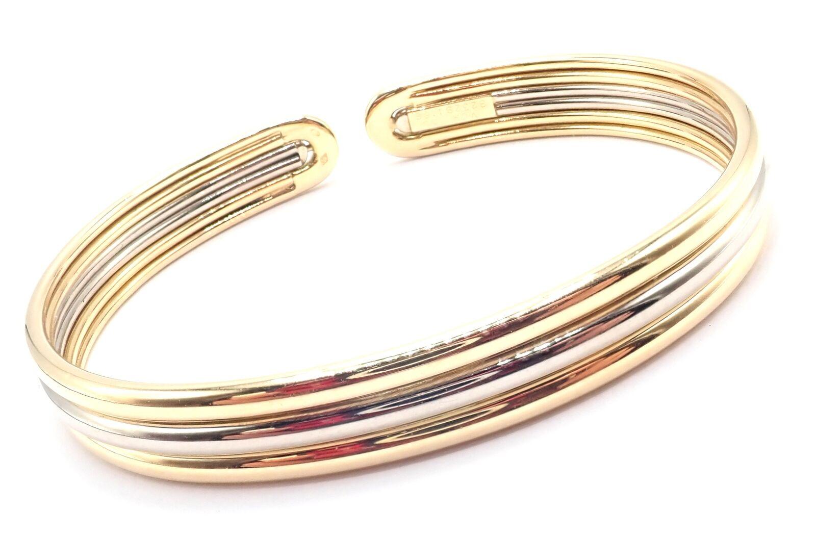 18k White & Yellow Gold Cuff Bangle Bracelet by Van Cleef & Arpels. 
The Van Cleef & Arpels bangle cuff bracelet is an epitome of sophistication, crafted from 18k yellow and white gold. 
This elegant piece showcases a timeless design, blending two