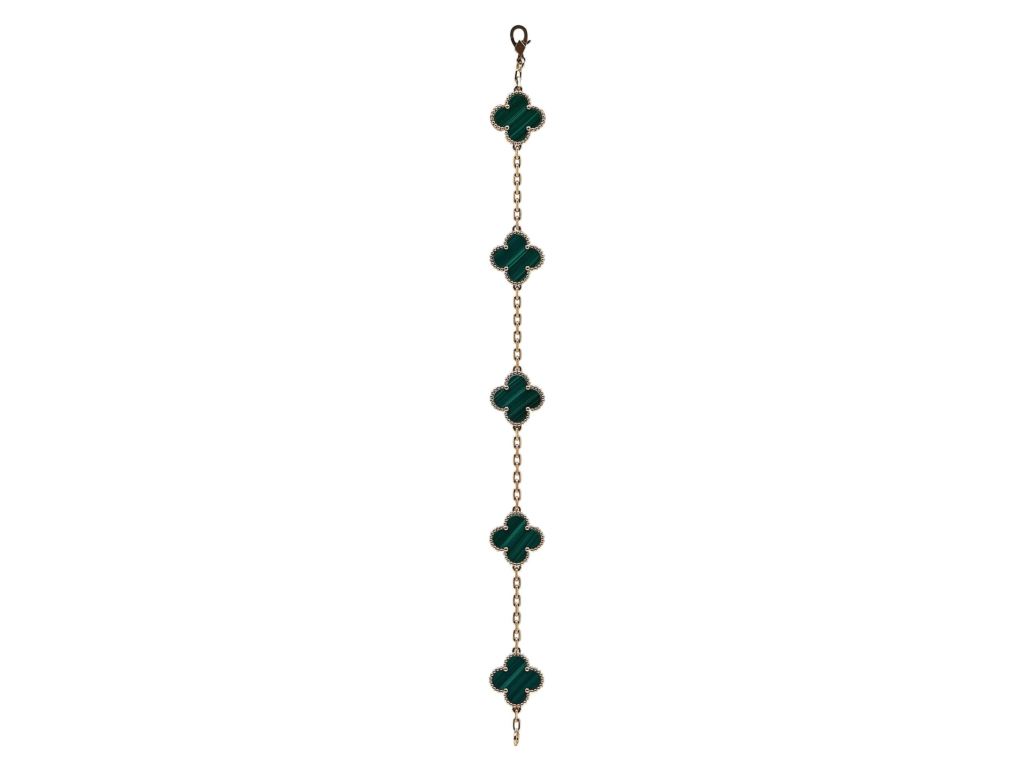 The bracelet: A Van Cleef & Arpels Vintage Alhambra eighteen karat yellow gold bracelet. The iconic quatrefoil motifs are composed of vivid and beautifully polished malachite. The bracelet is in excellent worn condition, showing light surface wear