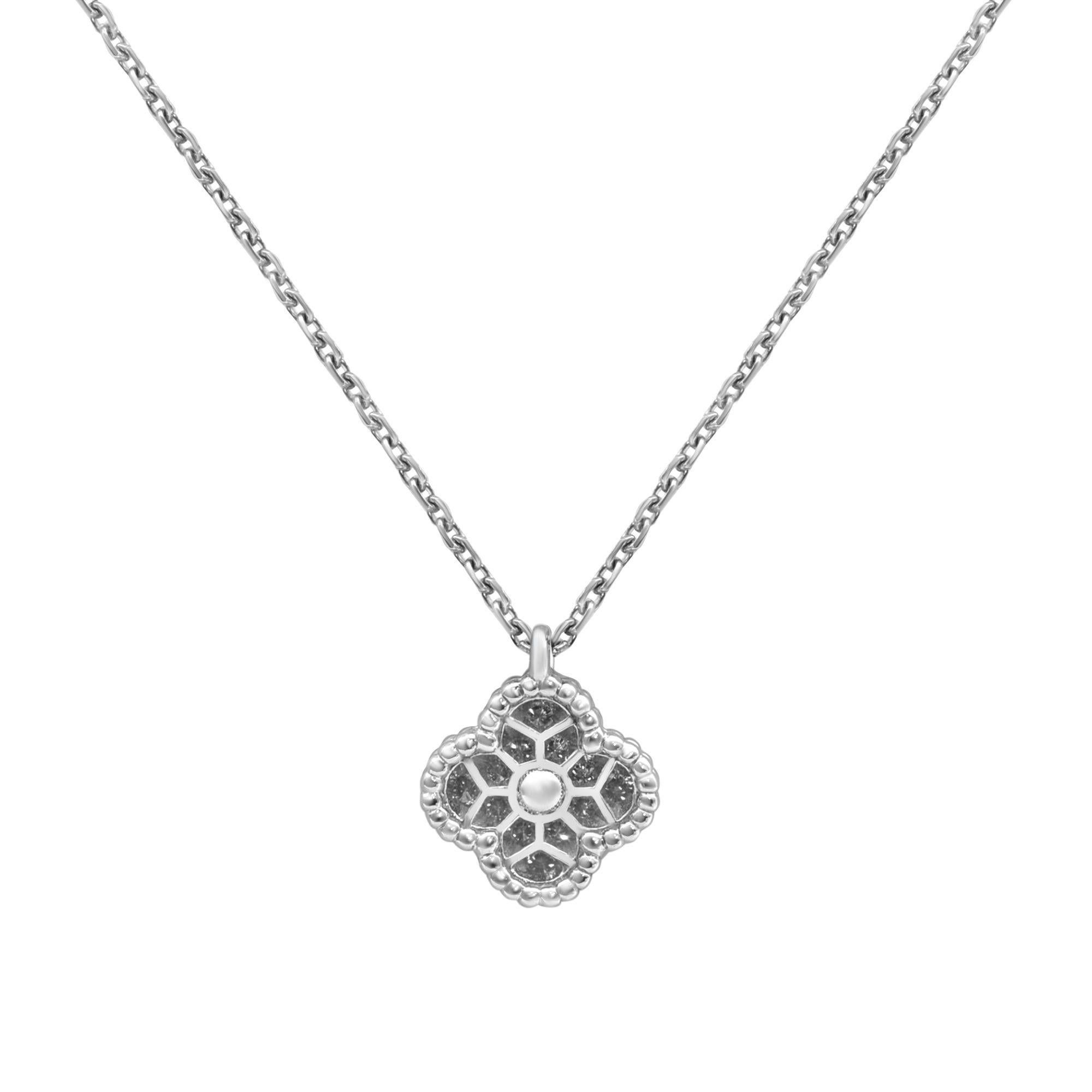 Van Cleef & Arples Sweet Alhambra mini pendant in 18k white gold. Set with 12 tiny round diamonds. Total carat weight 0.08. Diamond color DEF and clarity IF -VVS. Necklace length: 16 inches. Excellent pre-owned condition. Original box and papers are