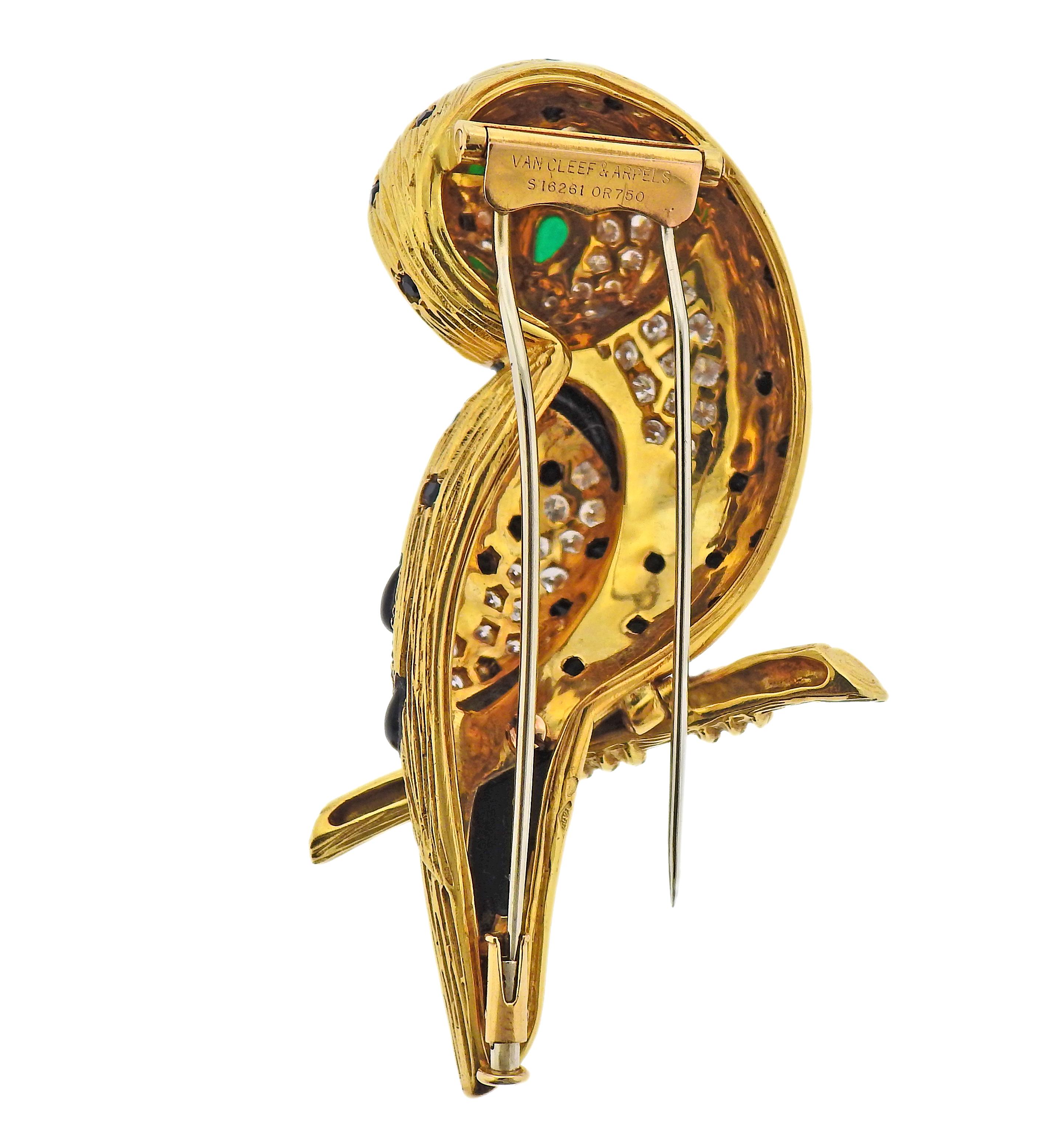 Van Cleef & Arpels 18k gold owl brooch, decorated with emerald cabochon eyes, onyx and approx. 2.20cts in diamonds. Brooch measures 62mm x 32mm. Marked: Van Cleef & Arpels, S16261,  or750. Weight - 35.9 grams.