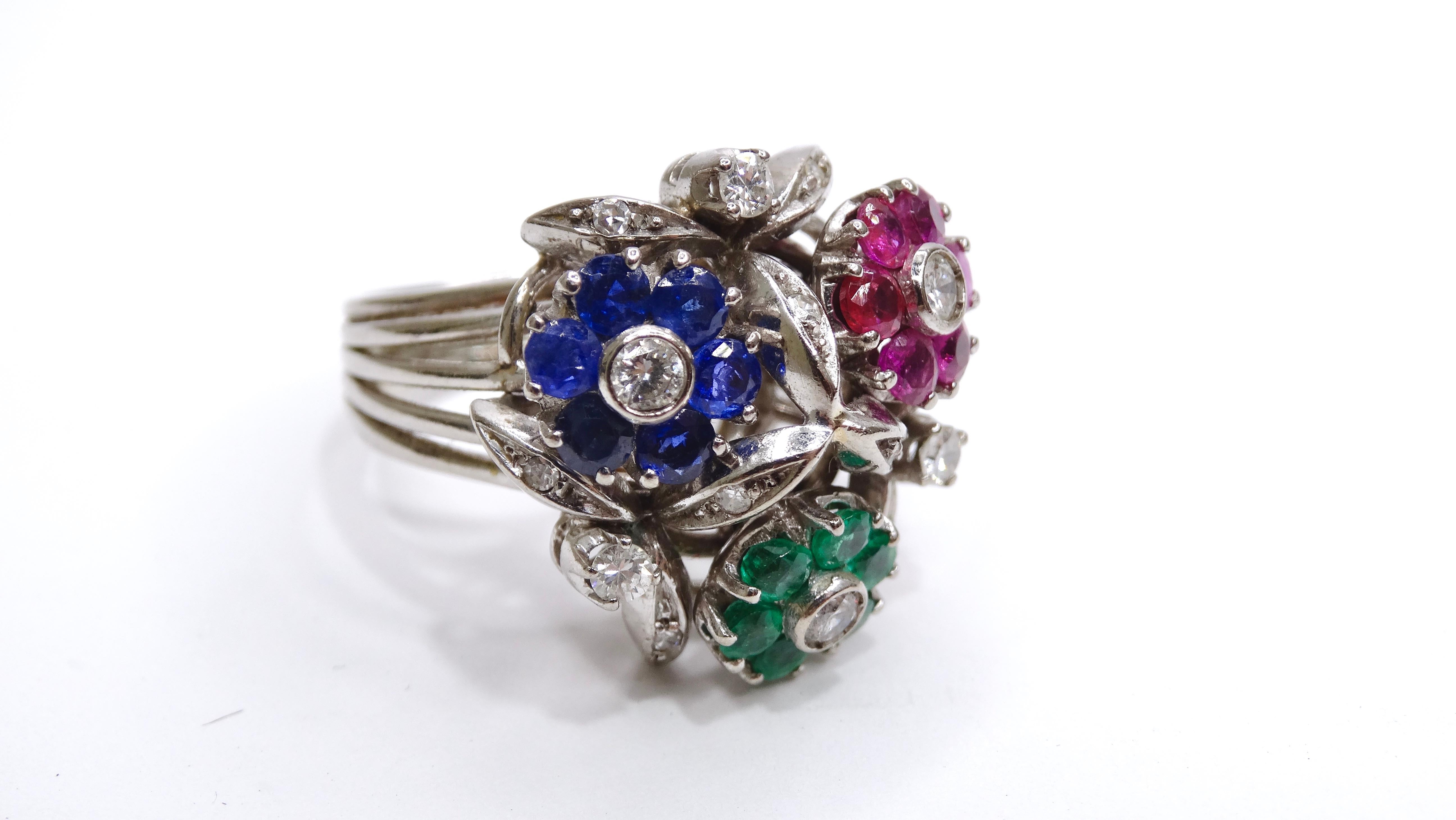 Bring a feminine flair to your ensemble with this ultra-rare VCA cocktail ring. Circa 1950's, this cocktail ring is made from platinum and weighs 12.09 total grams. This beautiful ring includes 6 Colombian emeralds  (0.45 ctw), 6 rubies (0.7ctw), 6