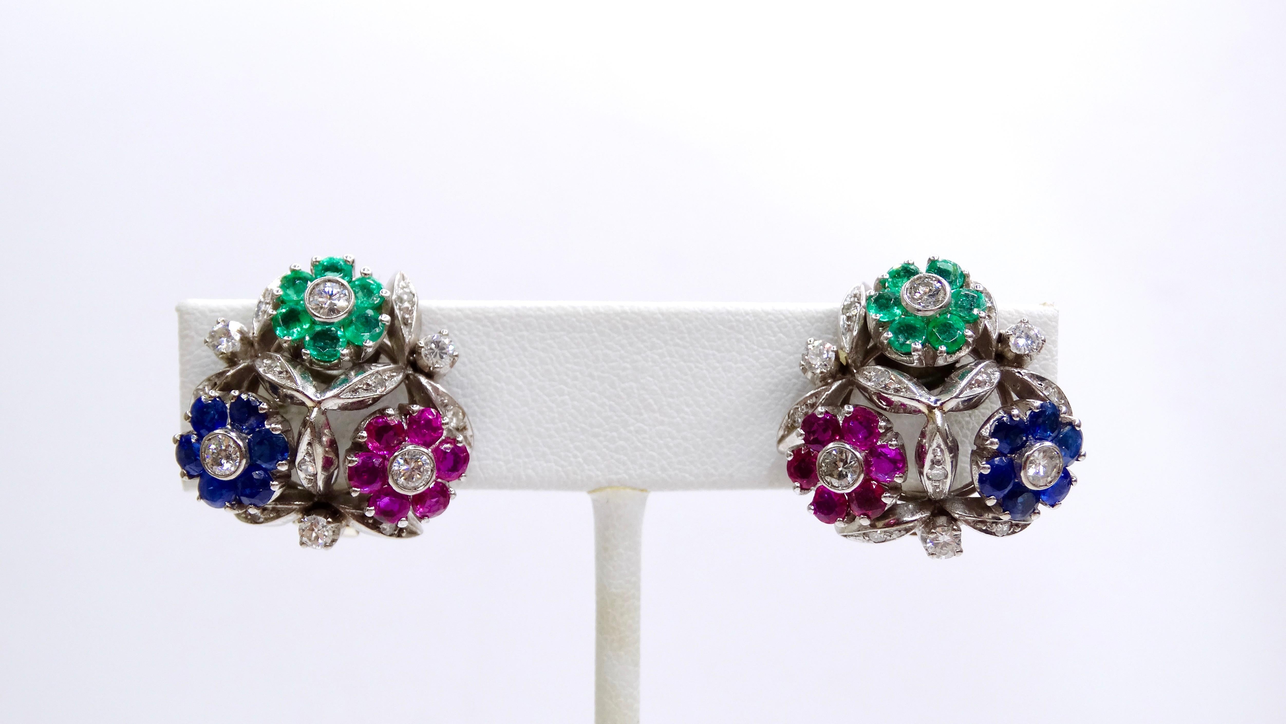 Bring a feminine flair to your ensemble with these flirty VCA earrings. Circa 1950's, these ultra-rare earrings are made from platinum and weigh 16.58 total grams. Include 12Colombian Emeralds (0.84ctw), 12 Rubies (1.44ctw), 12 Sapphires (1.44ctw),